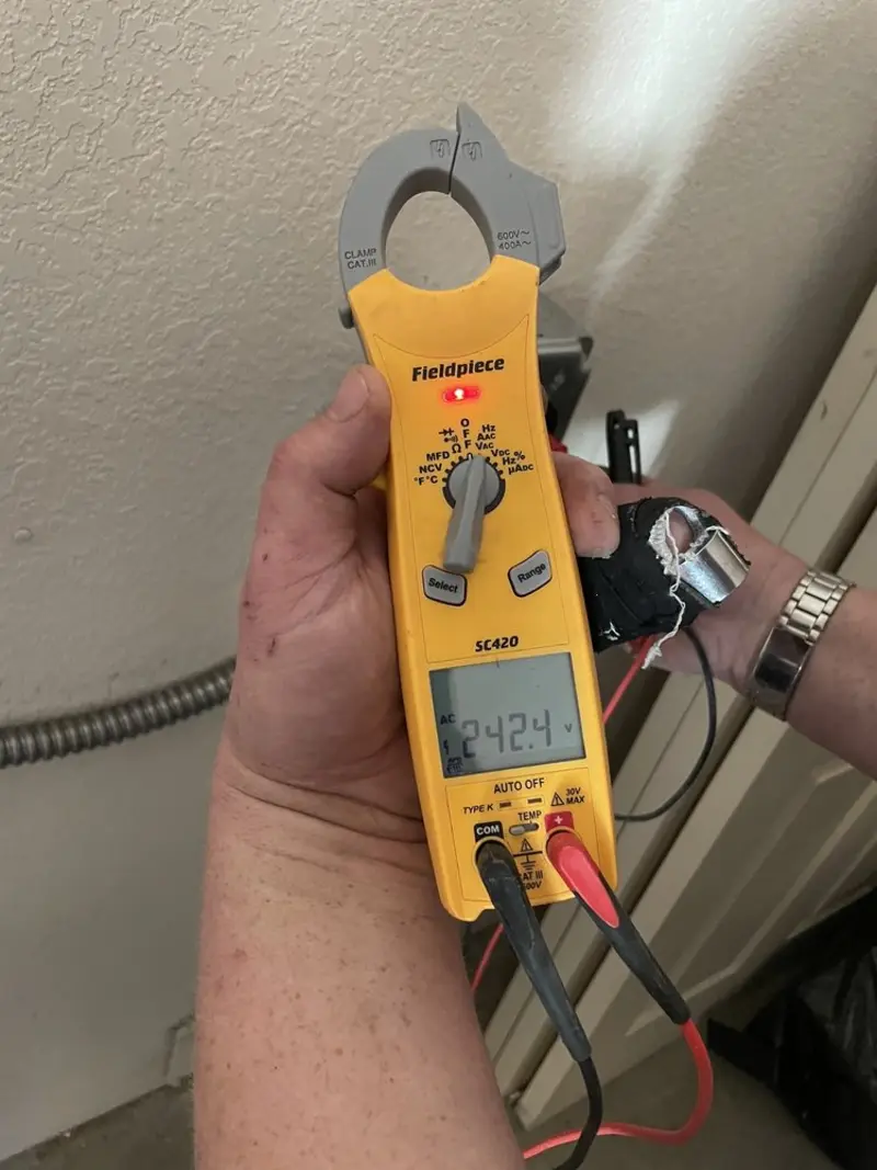 Voltage testing with clamp meter during Generator Installation in Clayton